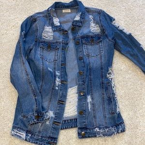 Jean jacket ripped/ with holes